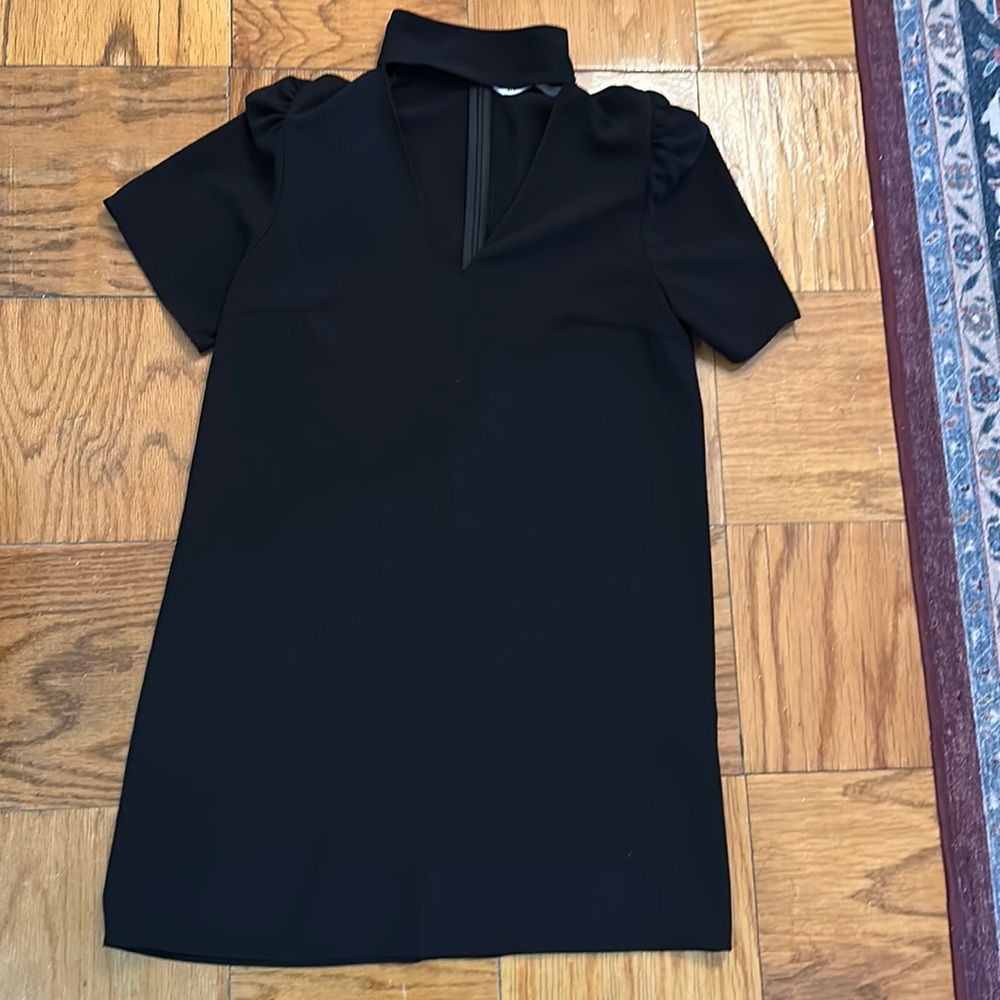 Black mock neck dress with v-neck cut out